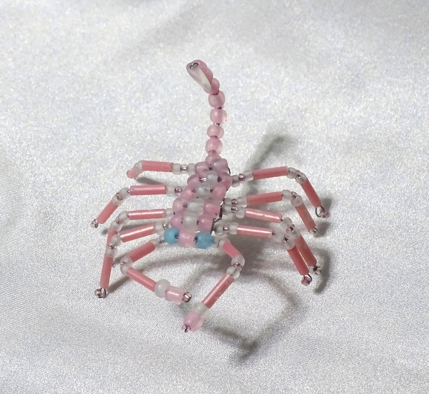 Blue Eyed Pink and White Scorpion