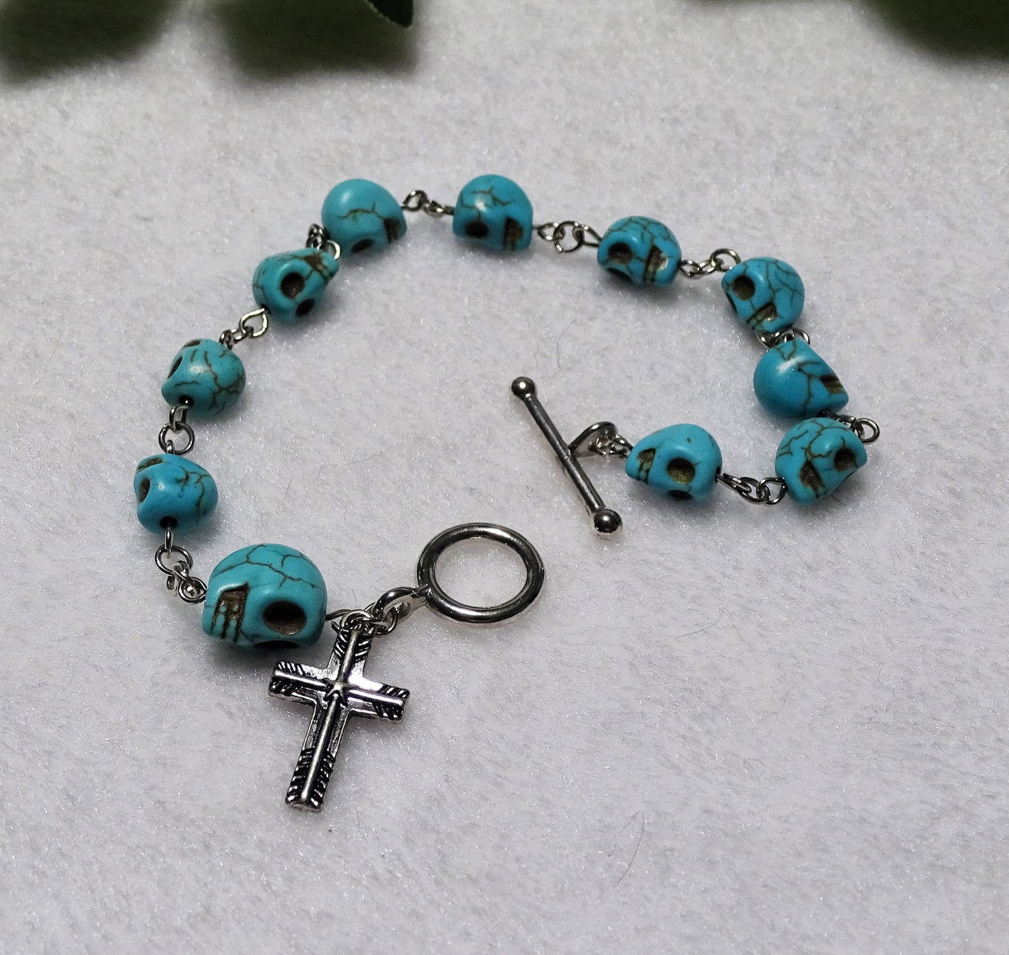 Turquoise Dyed Howlite Skull Rosary Bracelet