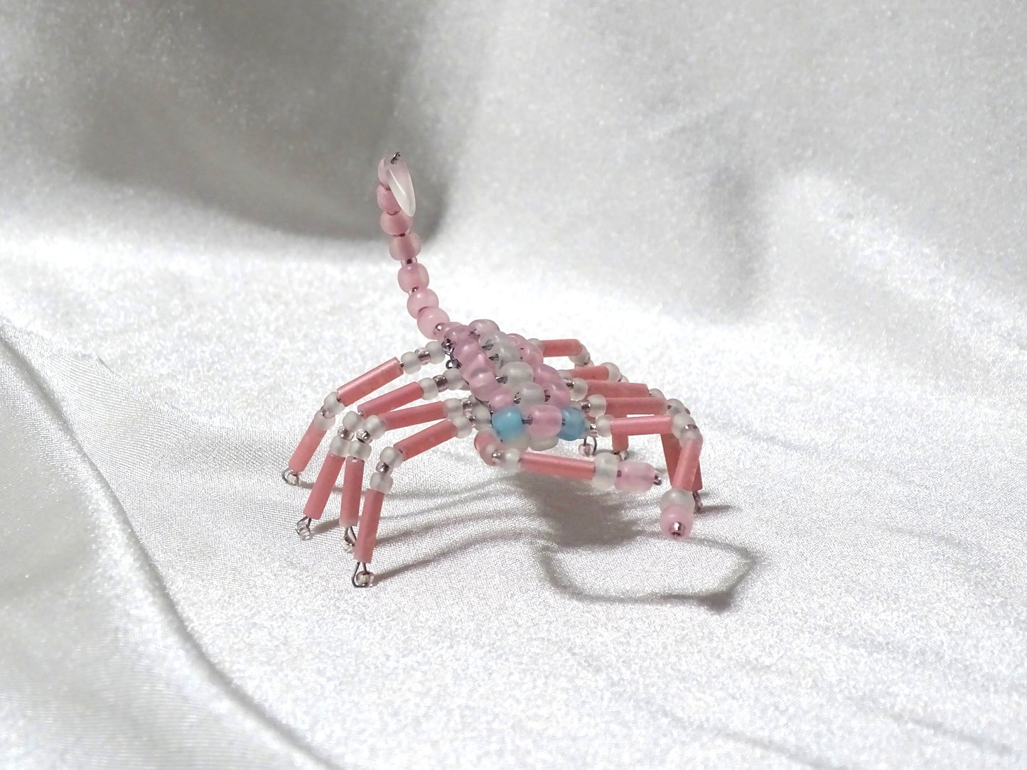 Blue Eyed Pink and White Scorpion