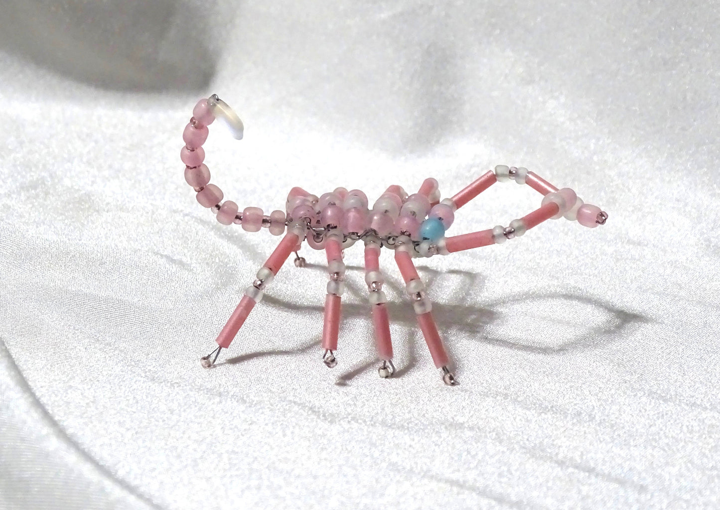 Blue Eyed Pink and White Scorpion