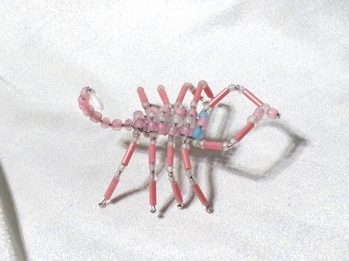 Blue Eyed Pink and White Scorpion