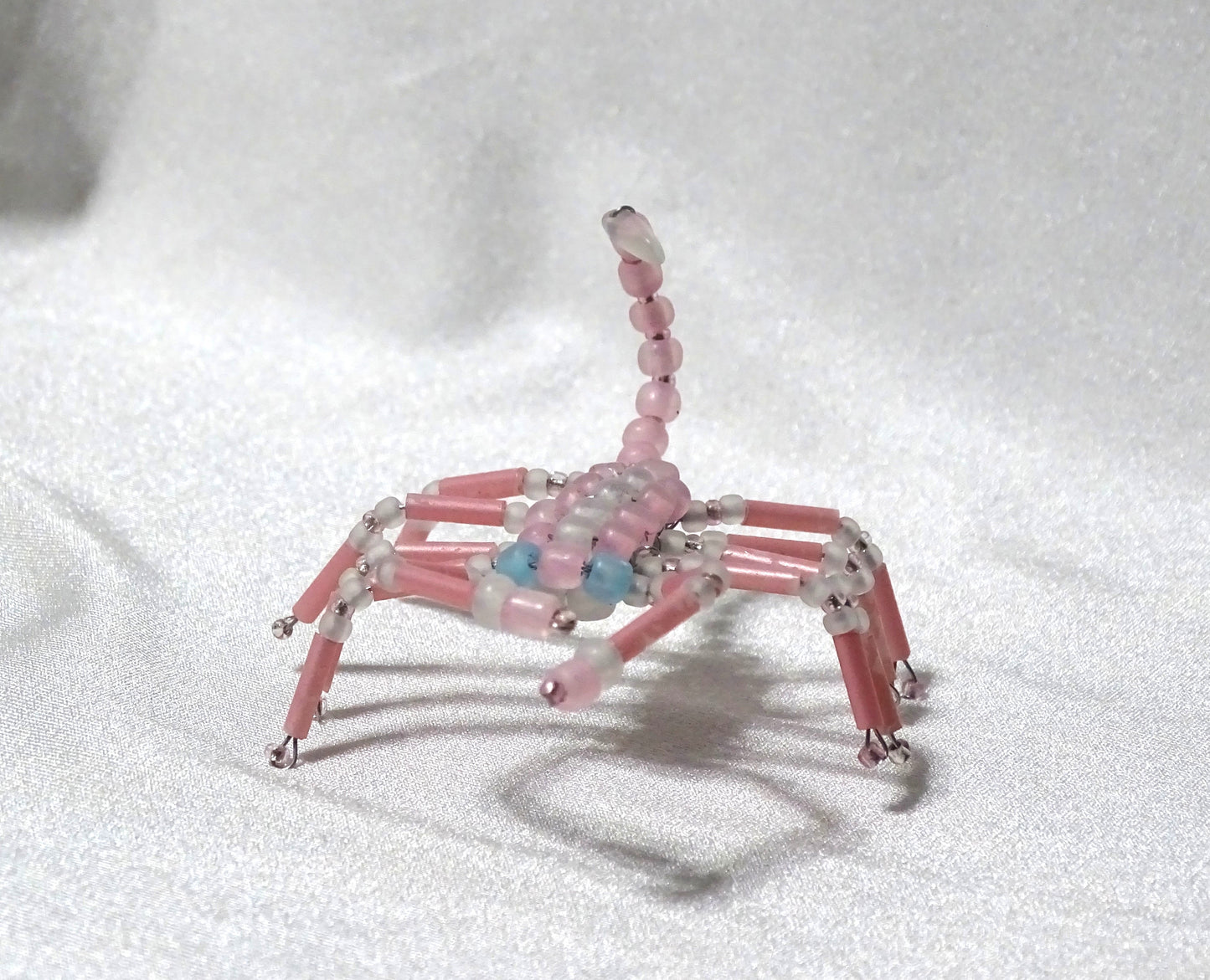Blue Eyed Pink and White Scorpion